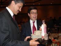 Richard Grinnel presents IDB President with Miniature ONIL Stove